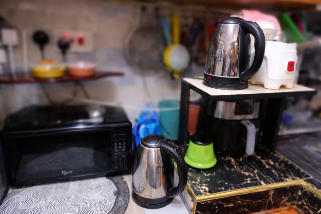 Cordless electric kettles in a home kitchen highlighting repairable household appliances