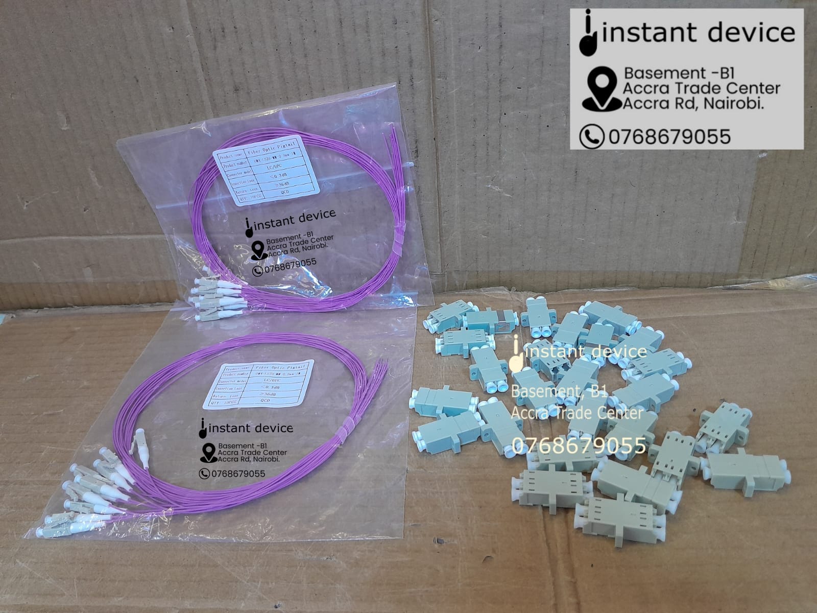 Pink OM4 LC fiber pigtails and Gray LC duplex adapters used to load a fiber optic panel